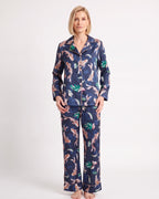 Women's satin pajama set with long-sleeve shirt and wide-leg pants; navy floral animal print