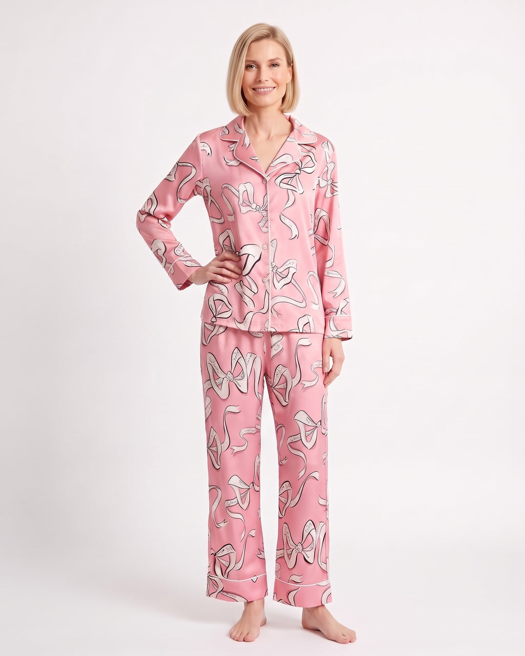 Women's satin pajama set with long-sleeve button shirt and wide pants; pink animal print