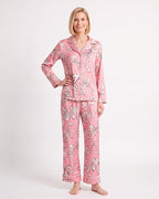 Women's satin pajama set with long-sleeve button shirt and wide pants; pink animal print