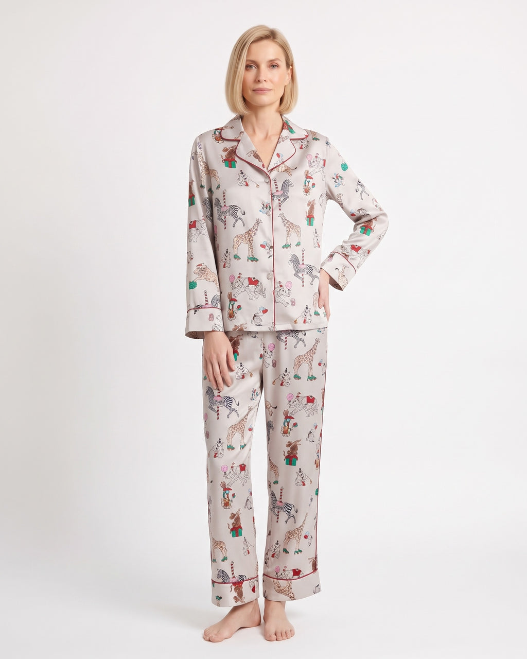 Women's satin pajama set with long-sleeve shirt and straight-leg pants; light print animal motifs