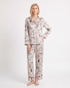 Women's satin pajama set with long-sleeve shirt and straight-leg pants; light print animal motifs