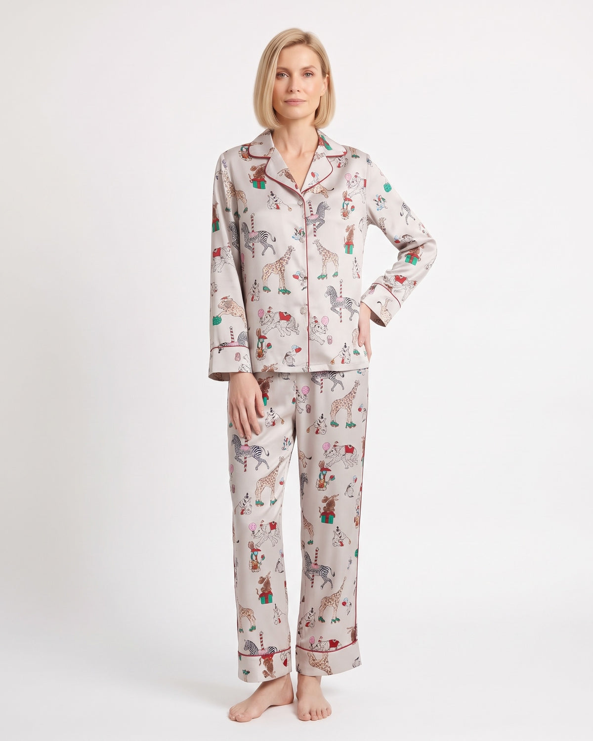 Women's satin pajama set with long-sleeve shirt and straight-leg pants; light print animal motifs