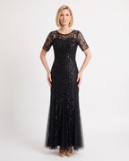 Black sequin mermaid gown with leaf embroidery, sheer short sleeves, and a tulle maxi skirt