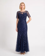 Navy blue sequin mermaid gown with leaf embroidery, sheer short sleeves, and a tulle maxi skirt