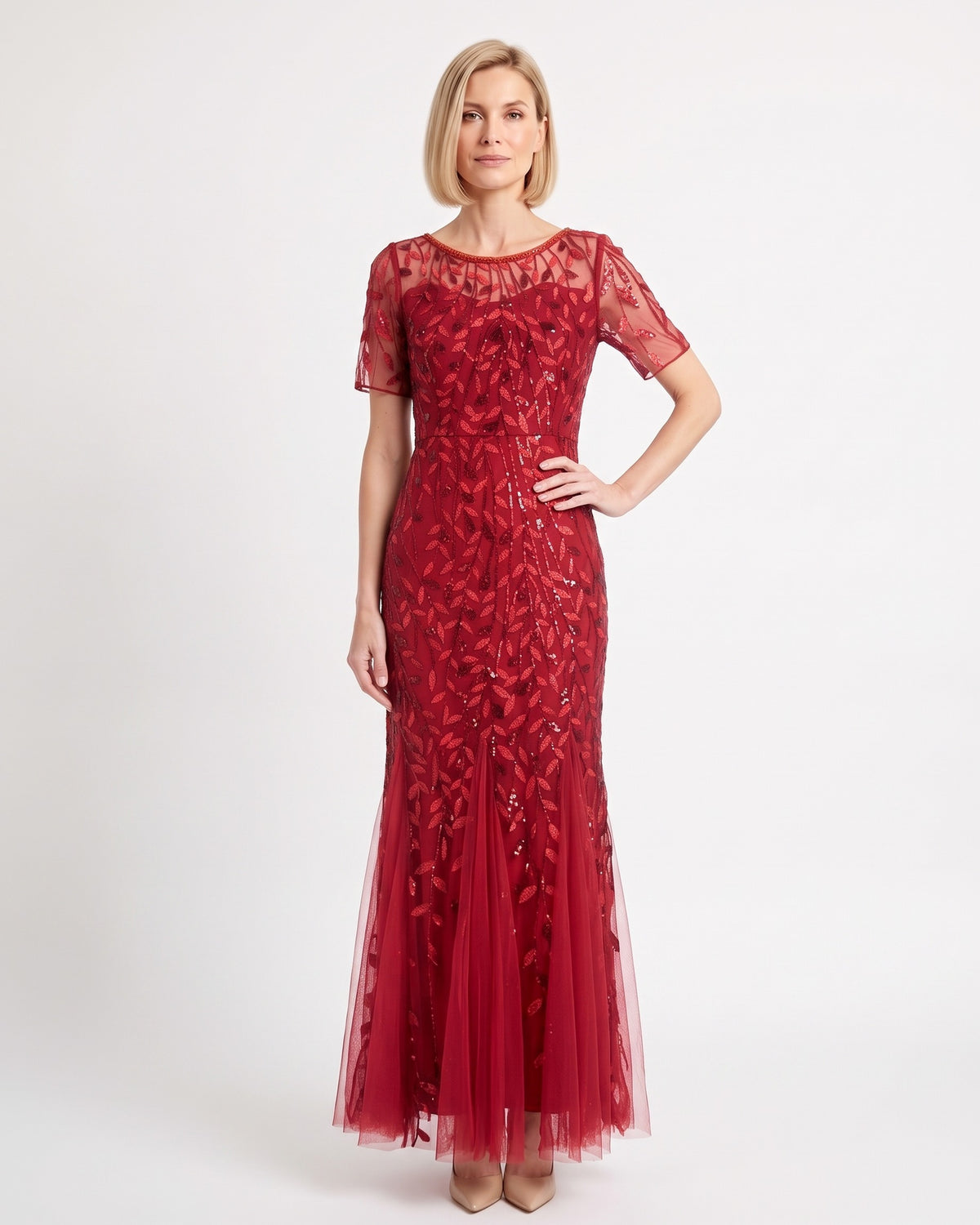 Red sequin mermaid gown with leaf embroidery, sheer short sleeves, and a tulle maxi skirt