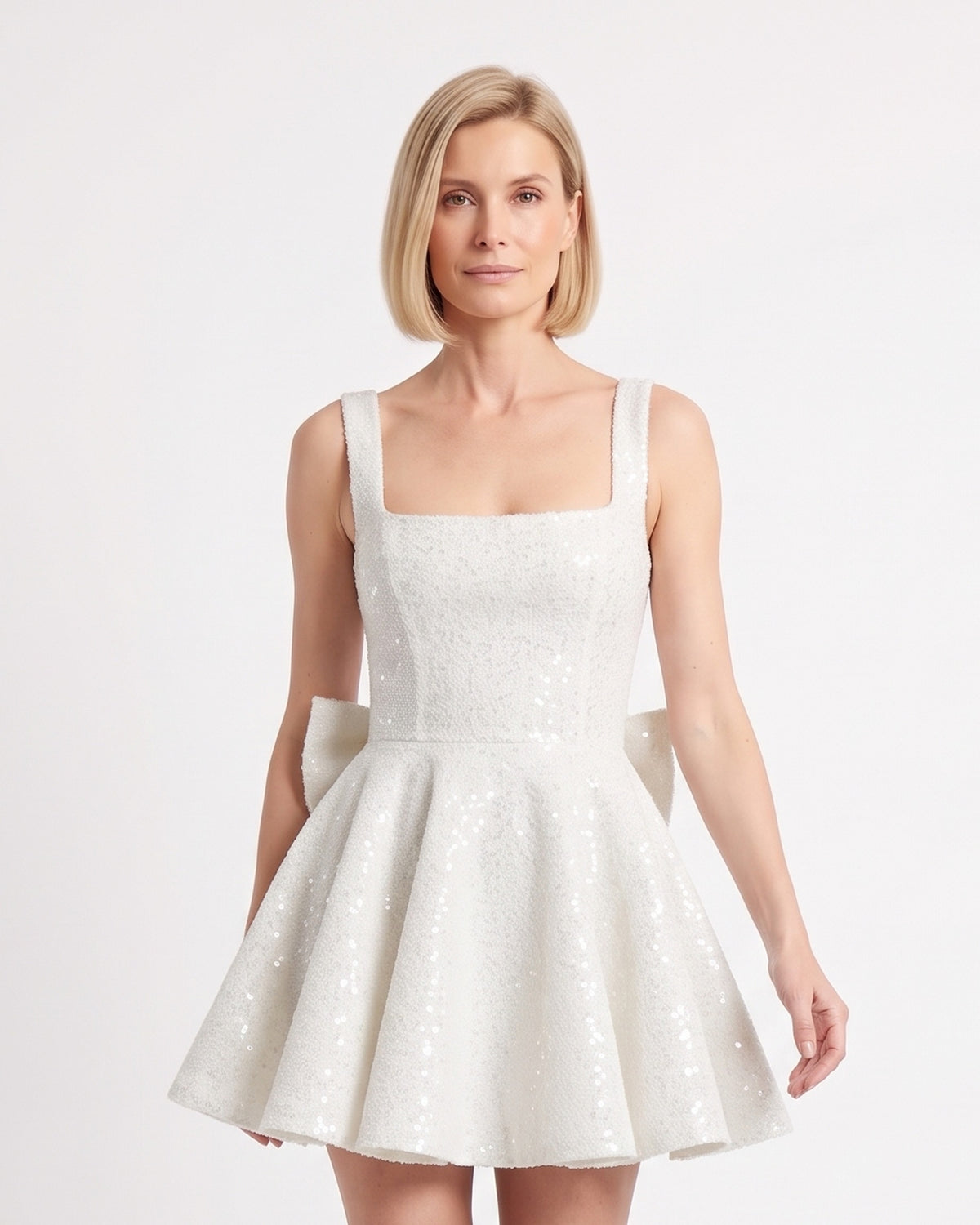White sequin mini dress, square neckline, fitted bodice and flared skirt