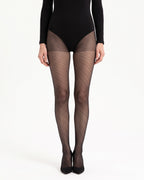Sheer black polka dot tights with diagonal dot pattern and control top