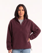 Women's sherpa half-zip fleece pullover in burgundy with stand collar and zip pocket