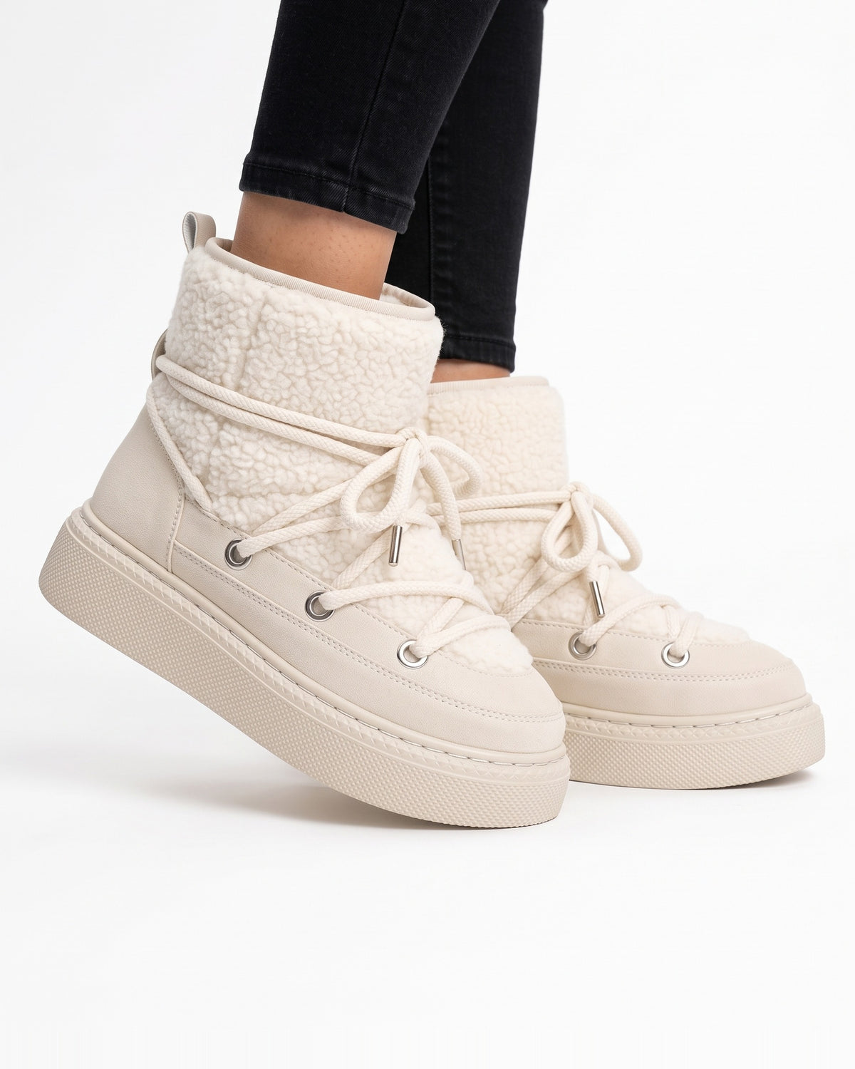 Off-white lace-up platform snow boots with sherpa-lined cuff and faux suede wrap laces