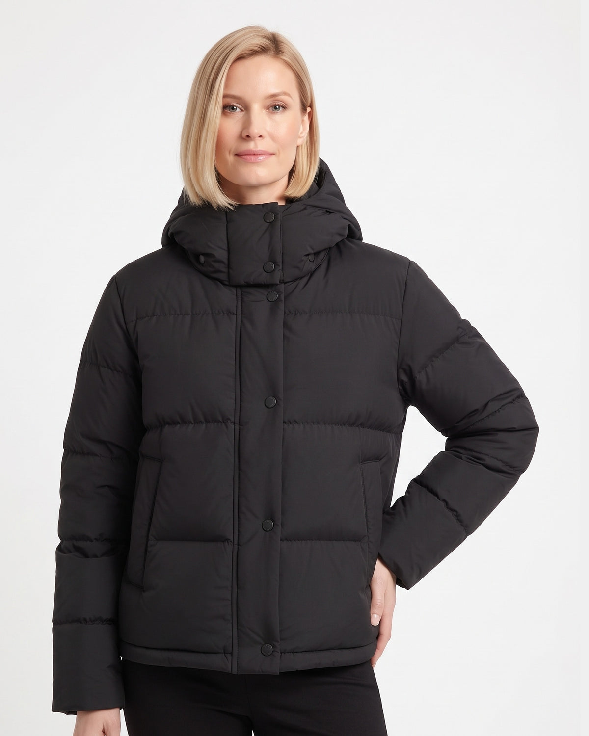 Cropped hooded puffer jacket in black with snap-front closure and quilted padding