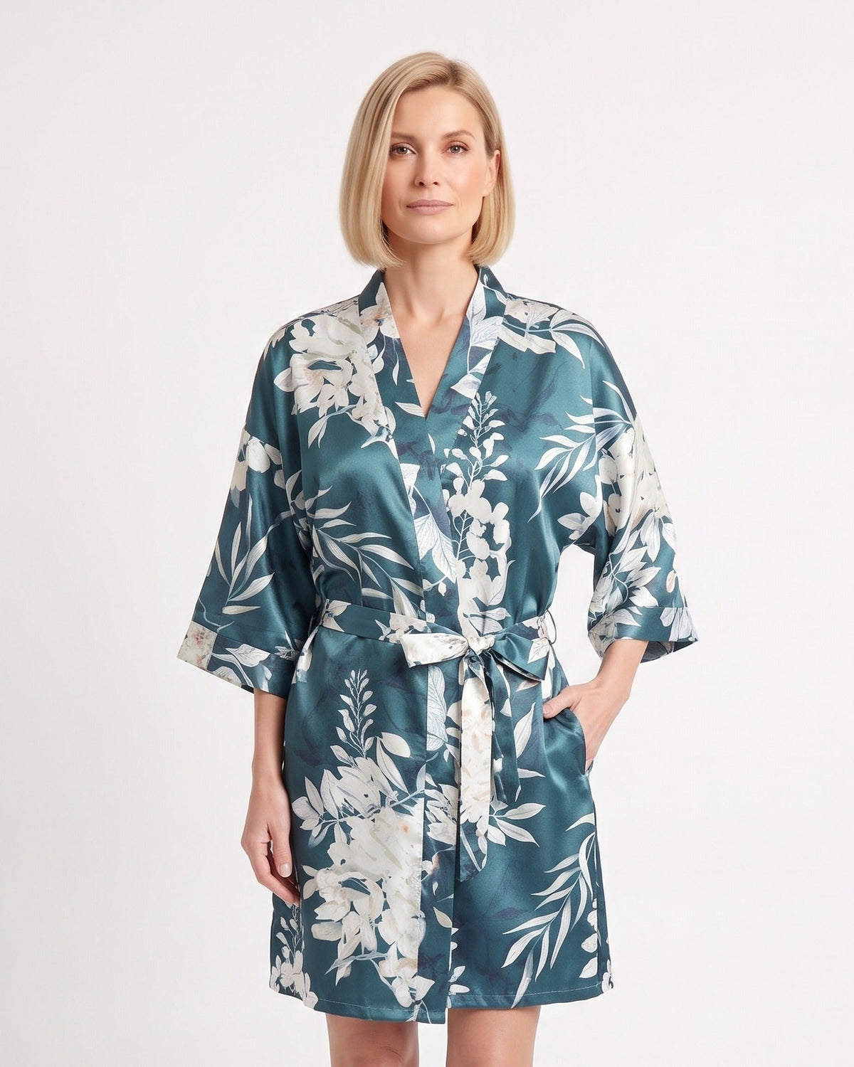 Teal satin kimono robe with white floral print, elbow-length sleeves, and tie belt