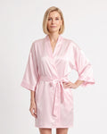 Short light pink satin robe with wide sleeves and a matching tie belt