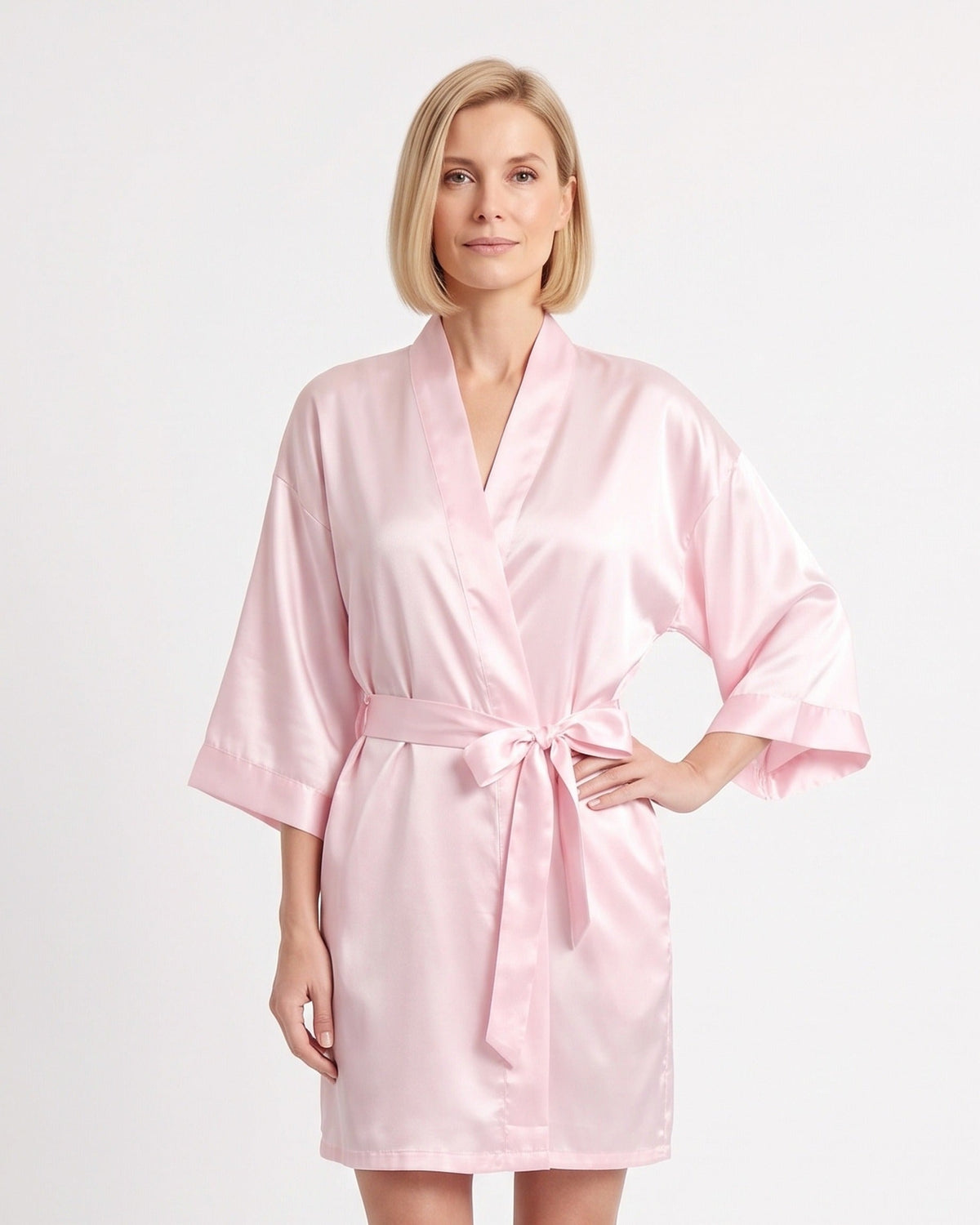 Short light pink satin robe with wide sleeves and a matching tie belt