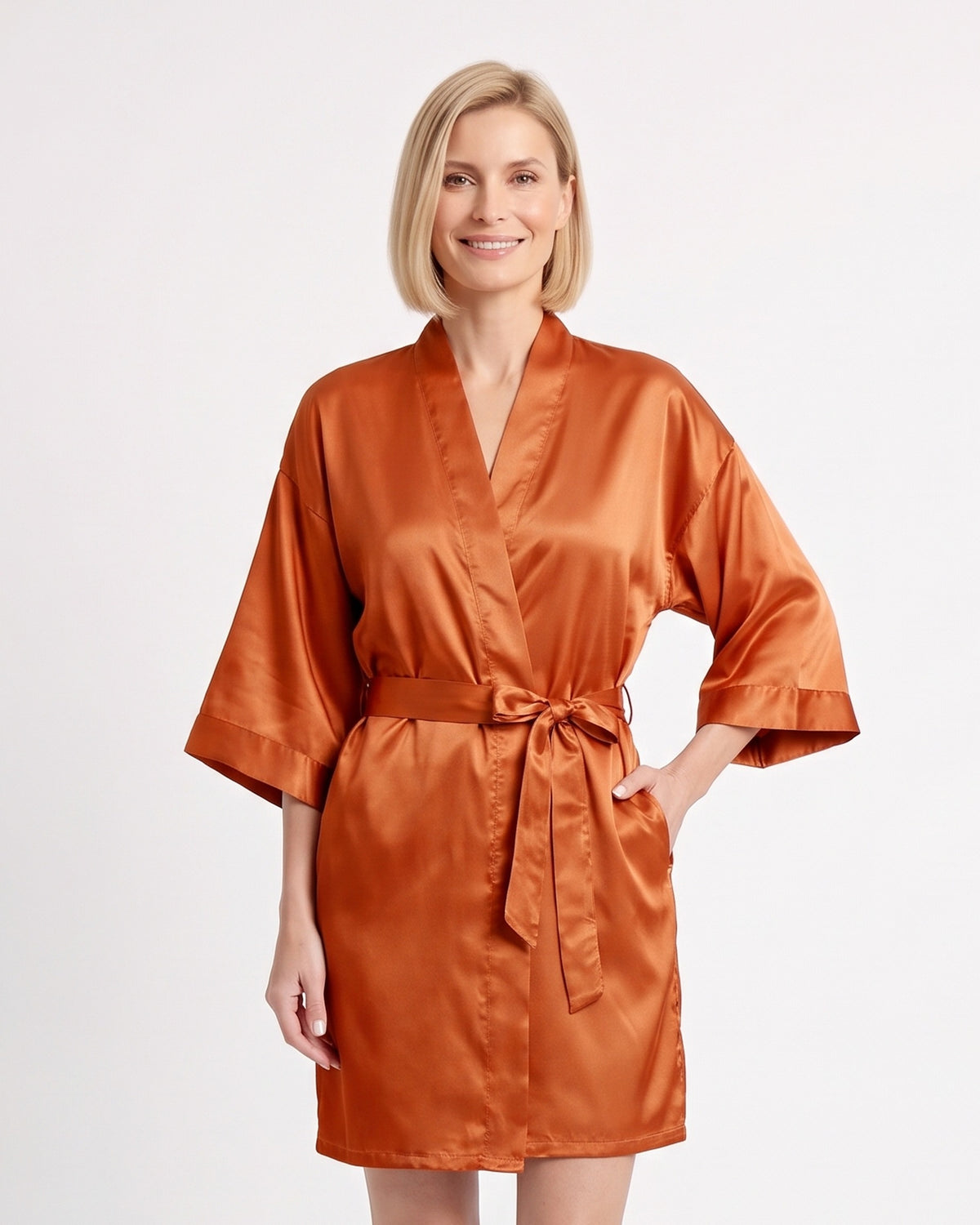 Short burnt orange satin robe with wide sleeves and a matching tie belt