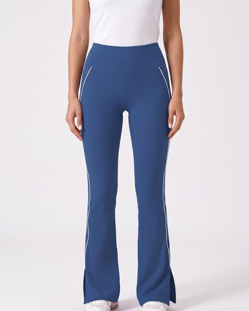 Navy blue high-waisted flare leggings with split hem and contrast piping