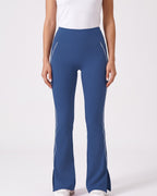 Navy blue high-waisted flare leggings with split hem and contrast piping