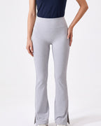 Light gray high-waisted yoga leggings with split flare hem and contrast side piping
