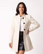 Off-white wool A-line coat with stand collar and button front, mid length, long sleeves