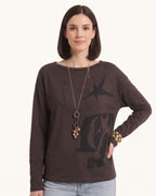 Dark brown long-sleeve graphic tee with star motif on chest, relaxed crew neck
