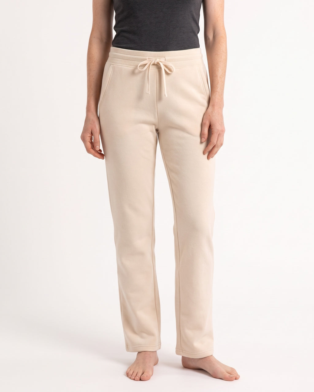 Women's cream fleece sweatpants with drawstring waist, open cuffs, side pockets