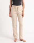Women's cream fleece sweatpants with drawstring waist, open cuffs, side pockets