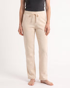 Women's cream fleece sweatpants with drawstring waist, open cuffs, side pockets
