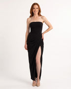Black strapless maxi dress with ruched draped bodice and high slit