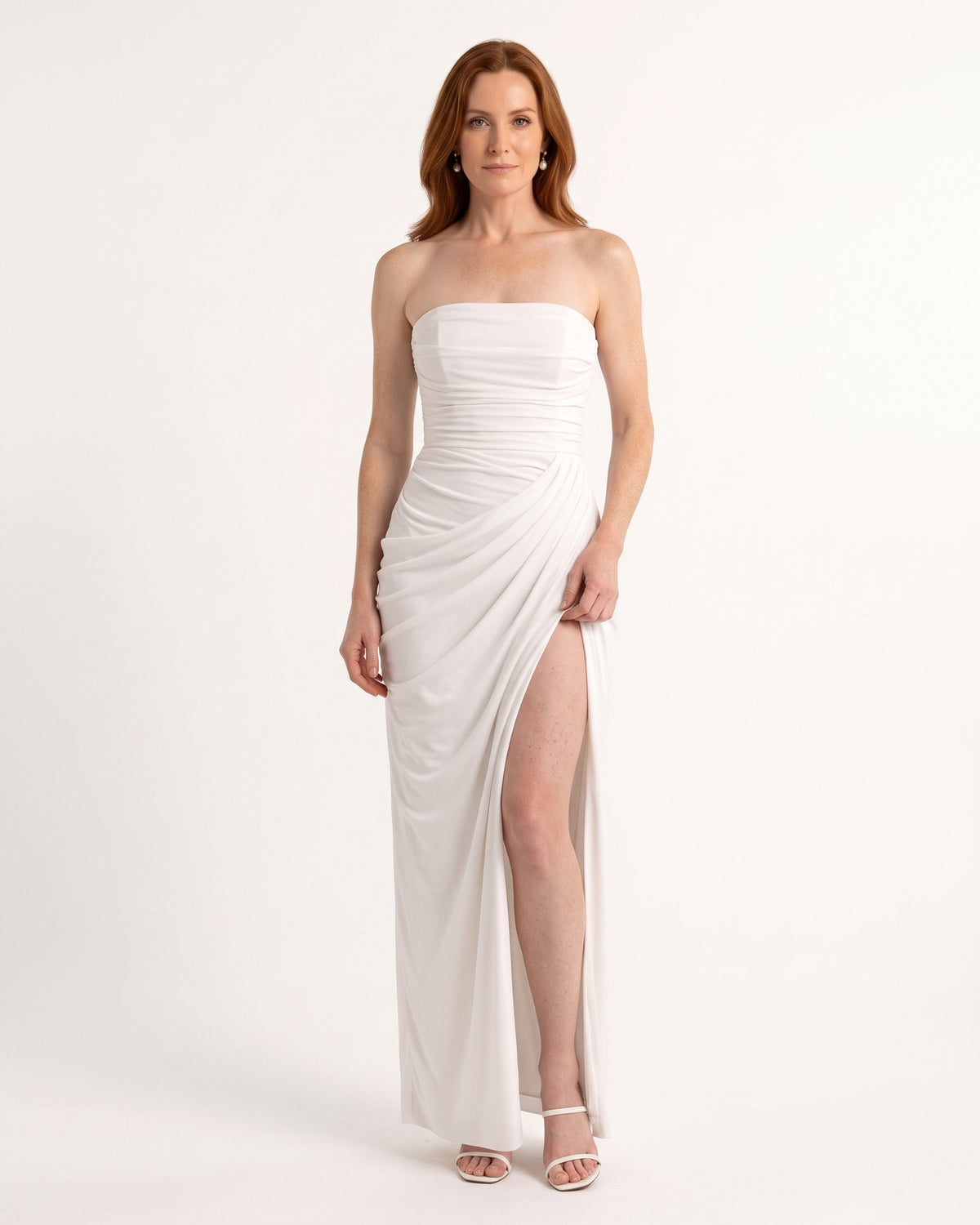 Strapless white maxi dress with ruched bodice, draped wrap skirt and high slit