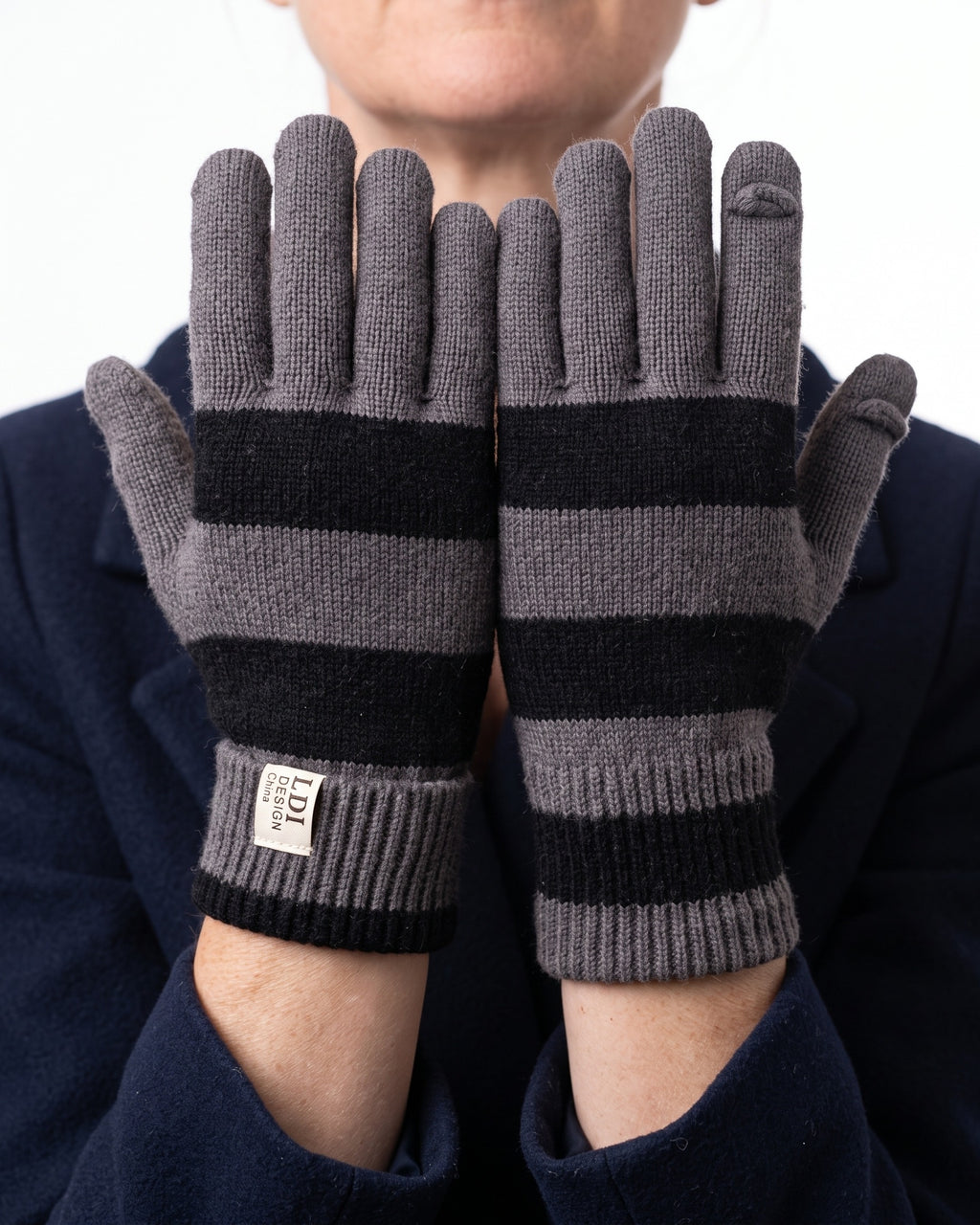 Striped knit gloves with long ribbed cuffs, gray and dark stripes with brand label