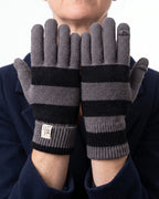 Striped knit gloves with long ribbed cuffs, gray and dark stripes with brand label