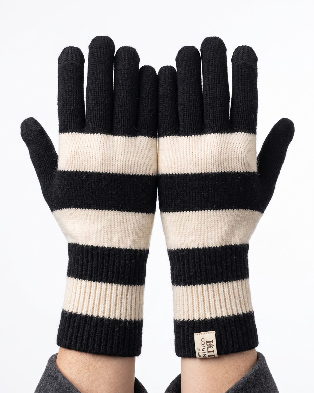 Striped knit gloves with long ribbed cuffs, black and white with light cream stripes