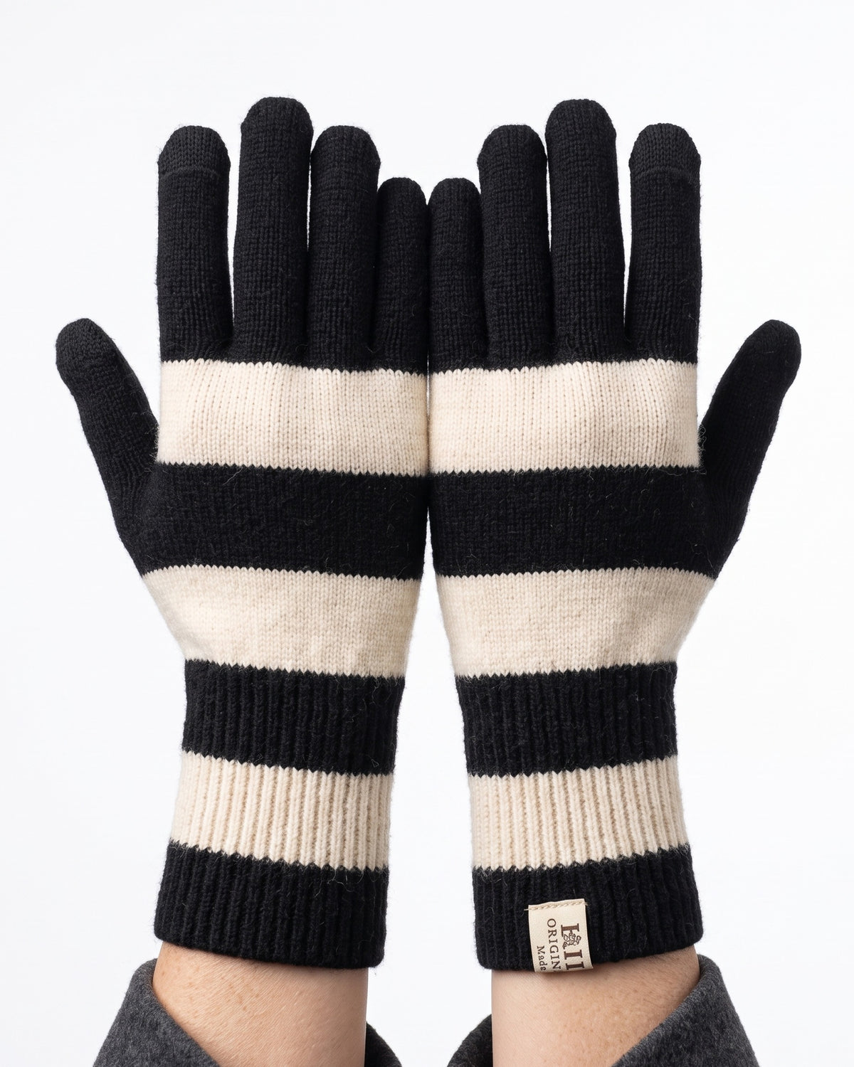 Striped knit gloves with long ribbed cuffs, black and white with light cream stripes