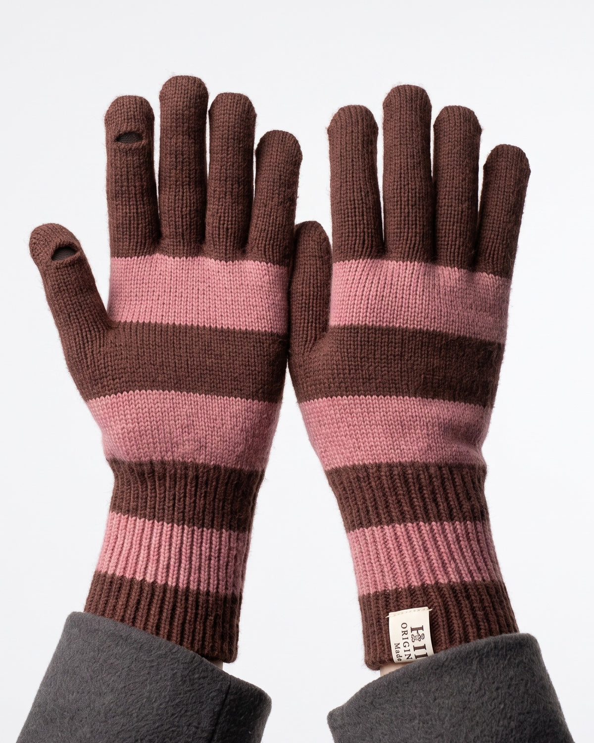 Striped knit gloves with long ribbed cuffs, brown and pink stripes with brand label
