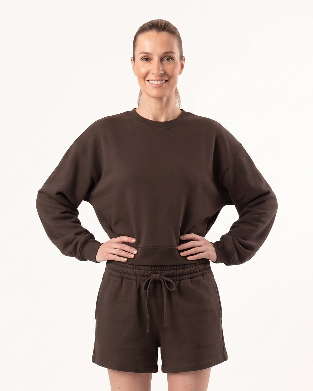 Dark brown crew neck sweatshirt with matching drawstring lounge shorts on a model.