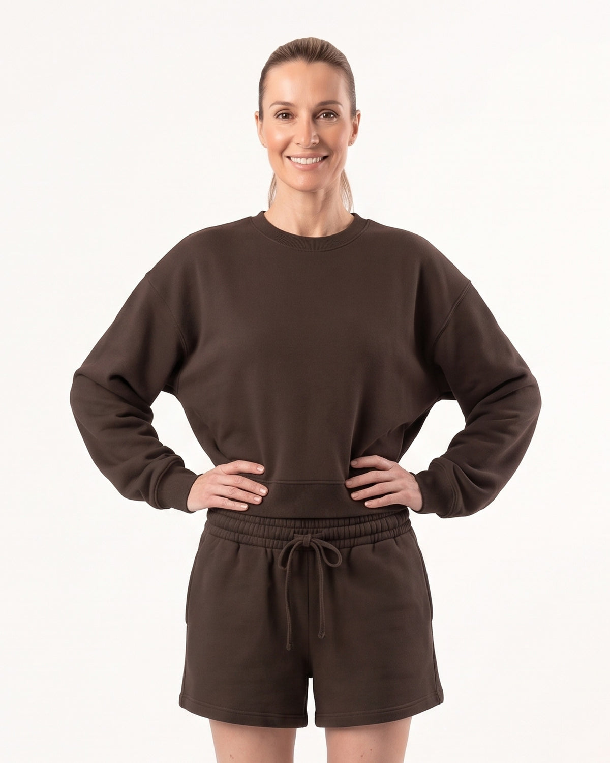 Dark brown crew neck sweatshirt with matching drawstring lounge shorts on a model.