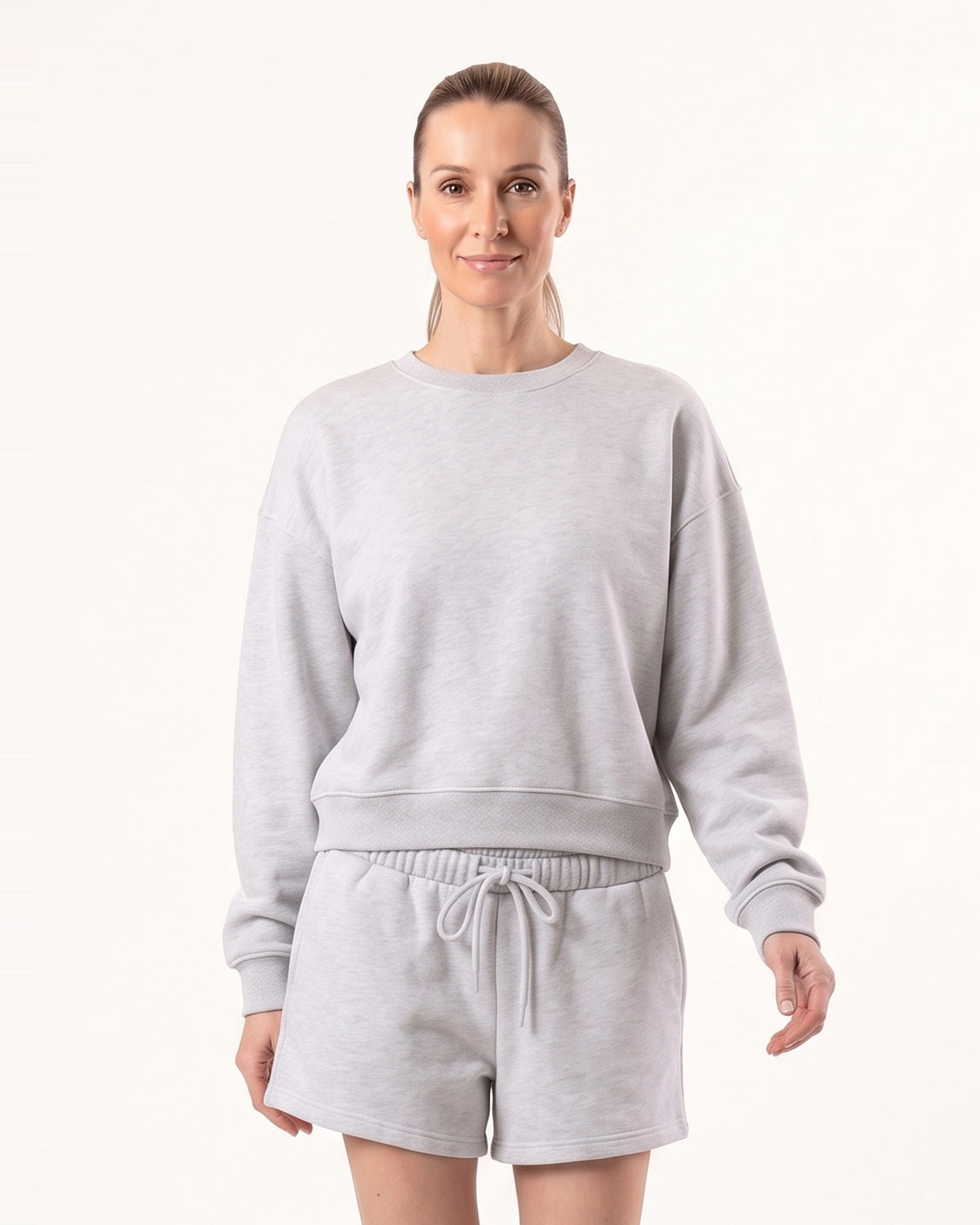 Light gray women’s fleece sweatshirt and matching drawstring shorts lounge set