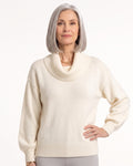Women’s off-white cowl-neck ribbed knit sweater, front view on model