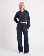 Navy sweatsuit with collared cropped half-zip top and wide-leg drawstring pants