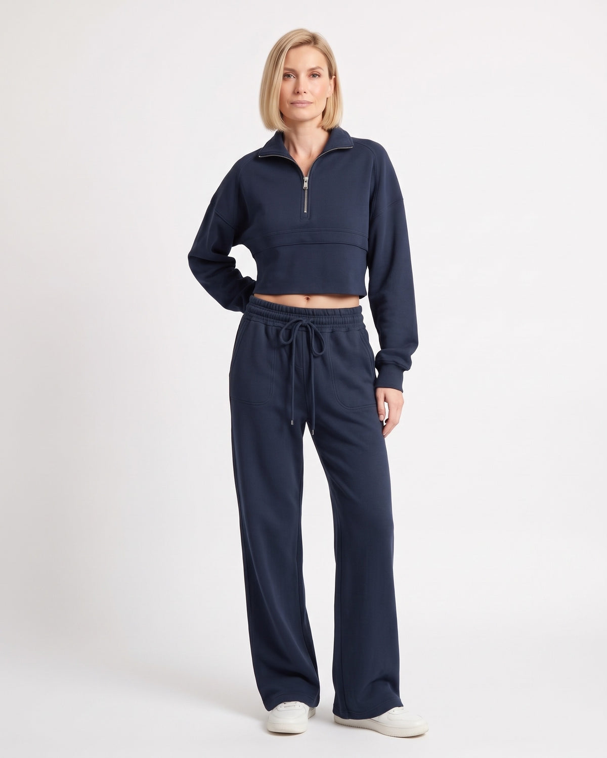 Navy sweatsuit with collared cropped half-zip top and wide-leg drawstring pants