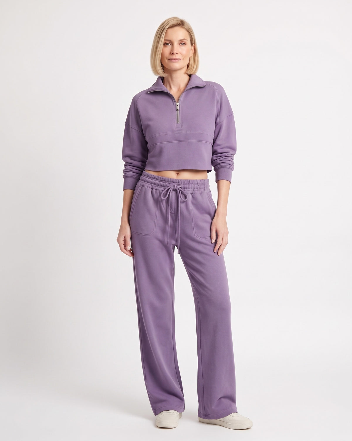 Purple sweatsuit with collared cropped half-zip top and wide-leg drawstring pants