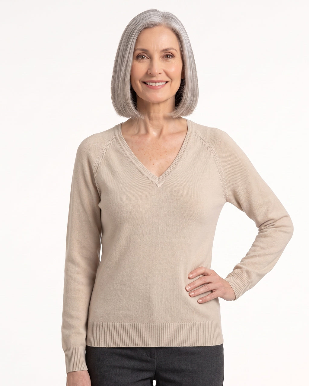 Beige V-neck fine-knit sweater with long raglan sleeves and ribbed cuffs