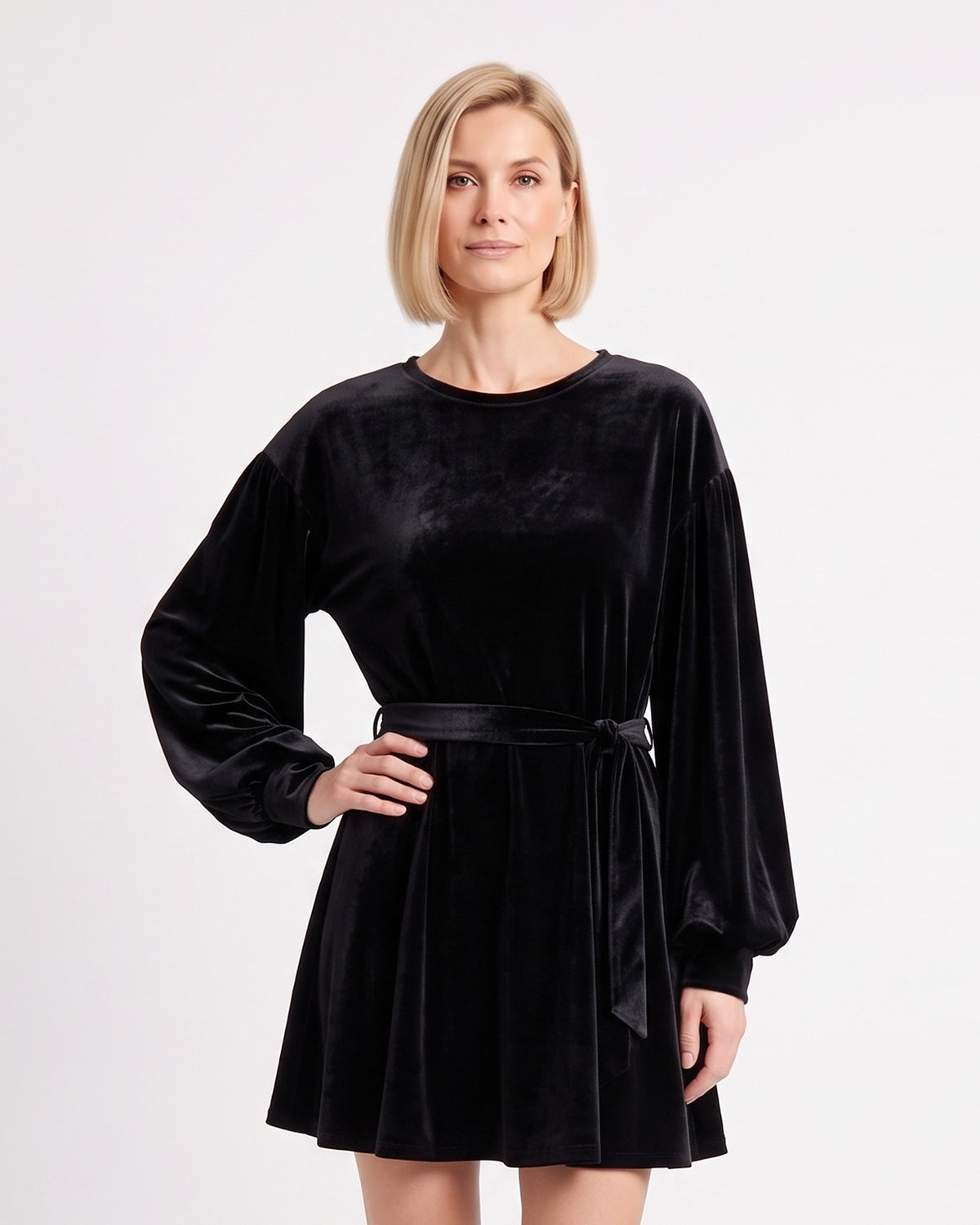 Black velvet mini dress with round neck, tie waist, and long lantern sleeves