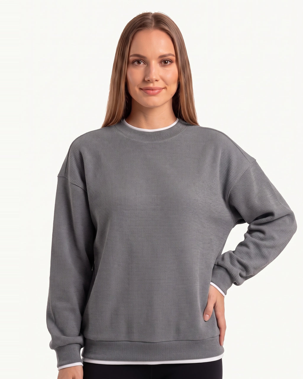 Gray waffle-knit crewneck sweatshirt with long sleeves and ribbed hem trim