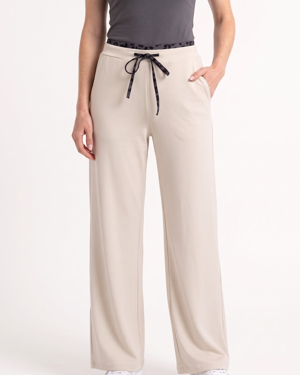 Beige wide-leg sweatpants with drawstring, elastic waist and side pockets