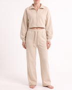 Beige wide-leg sweatpants with drawstring waist and front patch pockets, cotton blend