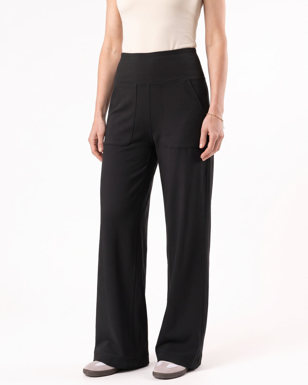 Black high-waisted yoga pants with wide legs and front pockets.