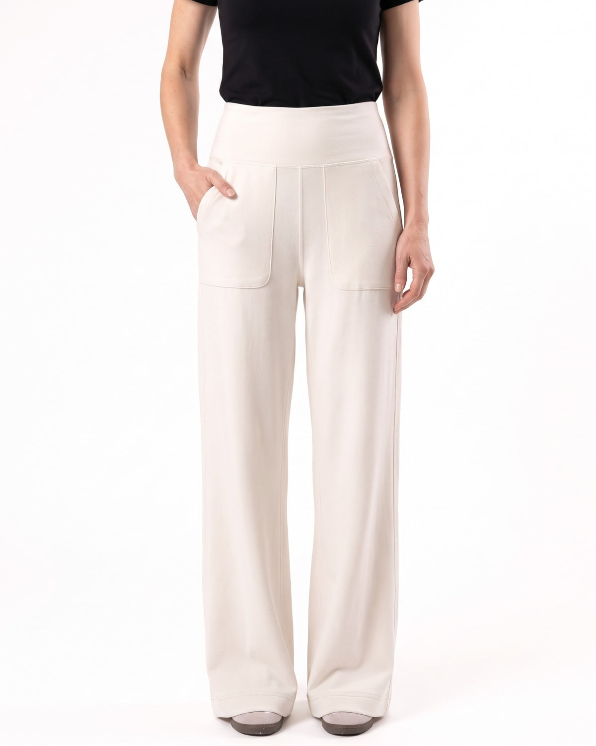 Off-white wide-leg yoga pants with a high waistband and front pockets.