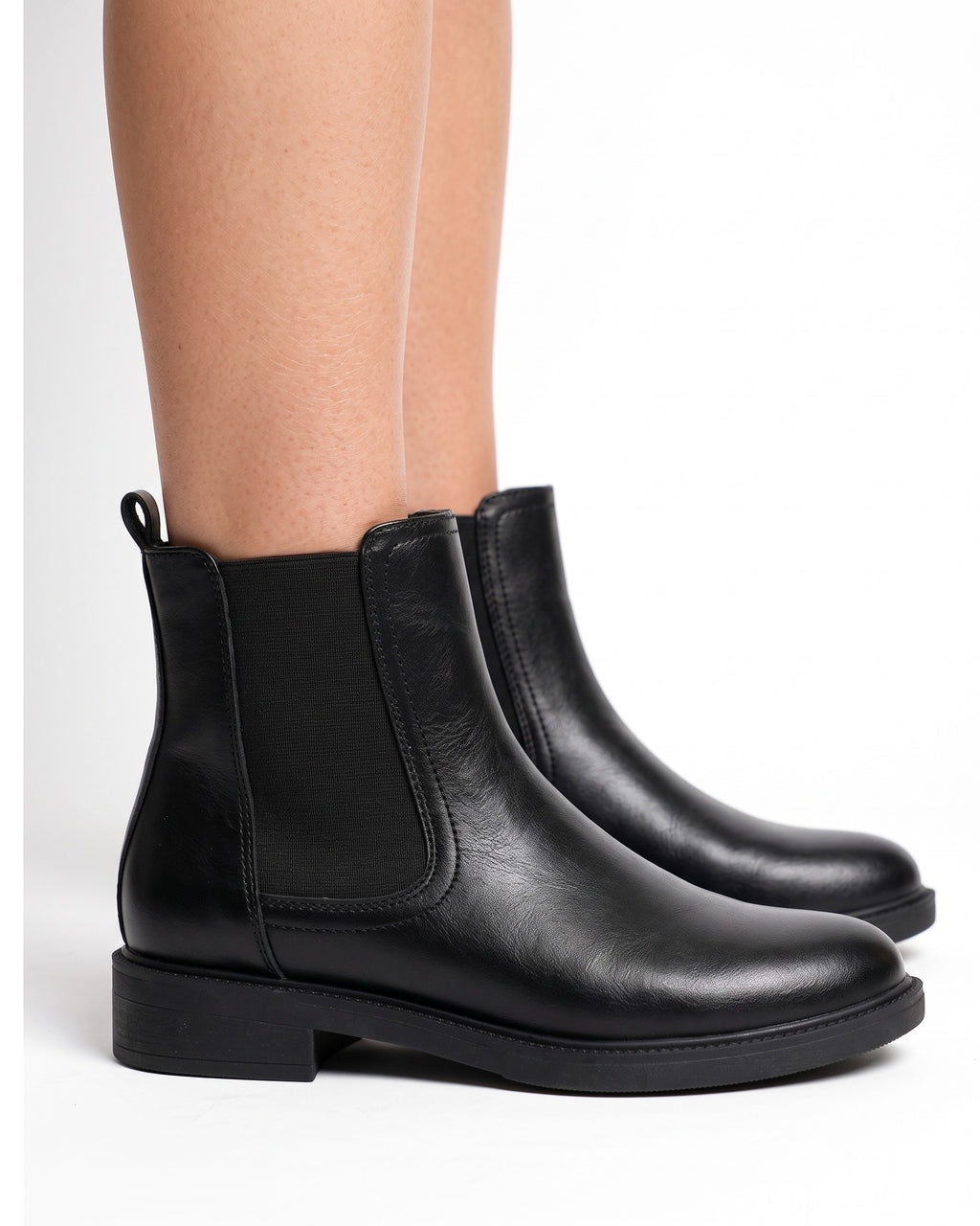 Black chelsea boots with elastic panels and side zip; low block heel, ankle height