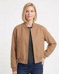 Women’s brown snap-front bomber jacket with ribbed cuffs, collar, and flap pockets