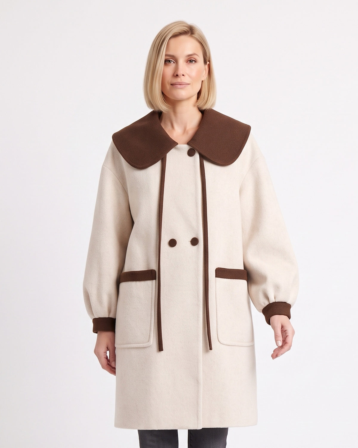 Women’s wool-blend coat in off-white with oversized brown collar and contrast pocket trim